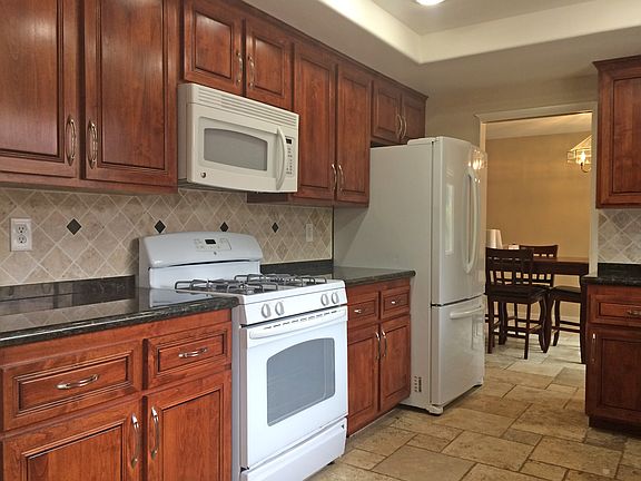 Gas stove, cherry cabinets