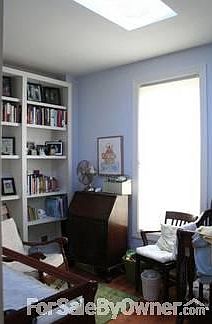 Bedroom 3
						:
						Skylight and built-in bookshelves.