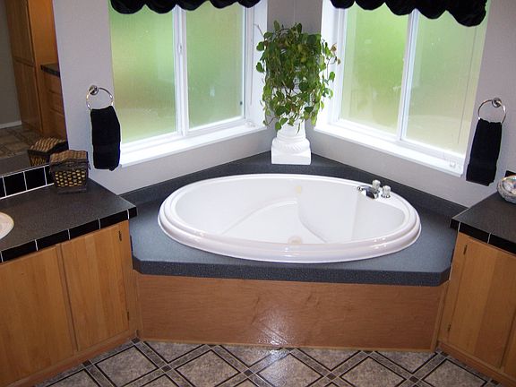 Masterbath has jet tub, walk-in shower