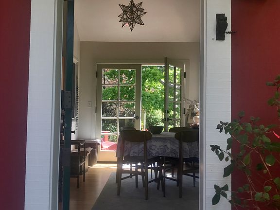 view from front door to dining area and French doors to garden