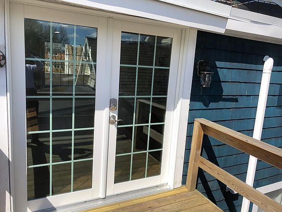 French doors entering the apartment from private deck.