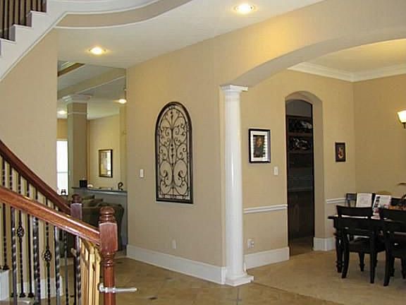 Covered front porch. French doors to 2 story study at front of house.