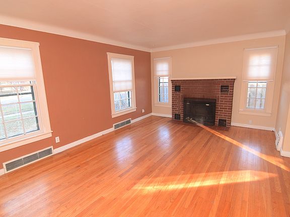 Cozy up to this wonderful wood burning fireplace on those cold winter nights. This living room features hardwood floors and 4 large windows that provide tons of natural sun light.