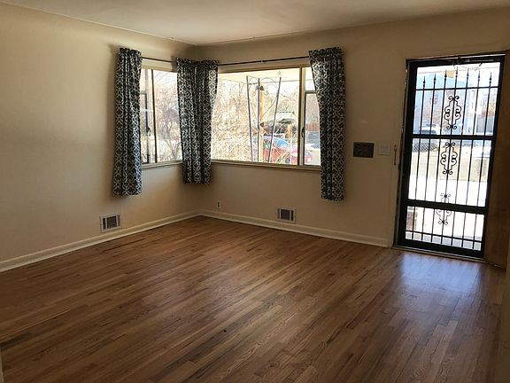 Living room, door to covered front porch.