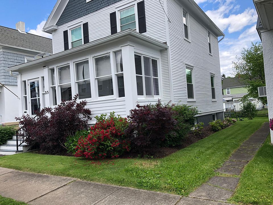 Wonderful colonial home with rare enclosed front porch.