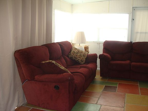 SUNROOM LEADING TO POOL AREA