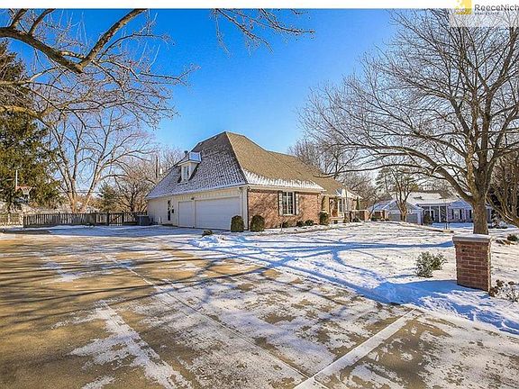Huge, wide driveway with plenty of room for parking compliments the 3 car side entry garage. Convenient side entrance door, too!
