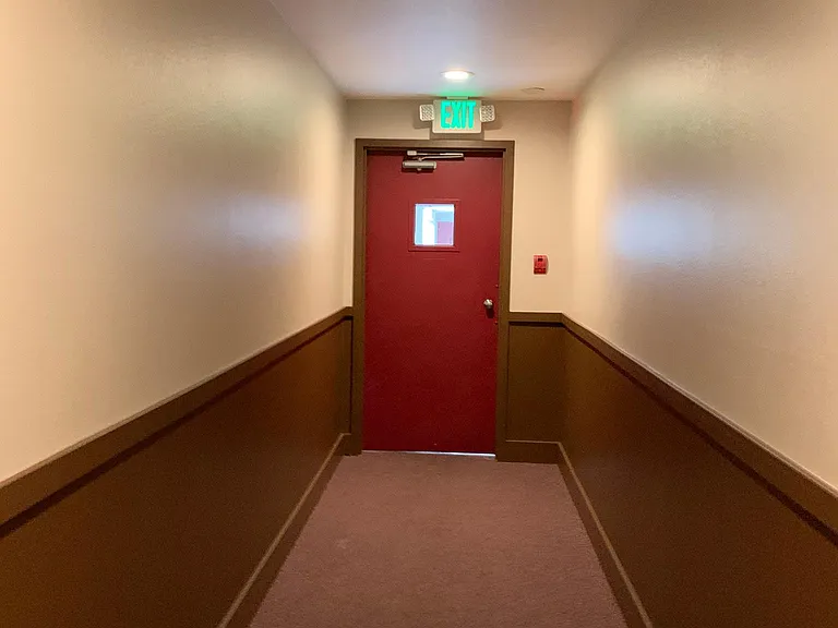 Secured building. Hallway from unit to elevator/mailroom/trash receptacle
