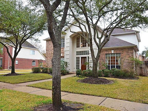 THIS ELEGANT HOME HAS MATURE TREES!