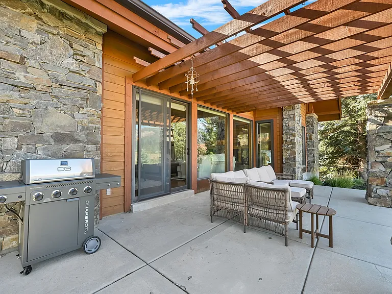 Outdoor patio with furniture and BBQ grill