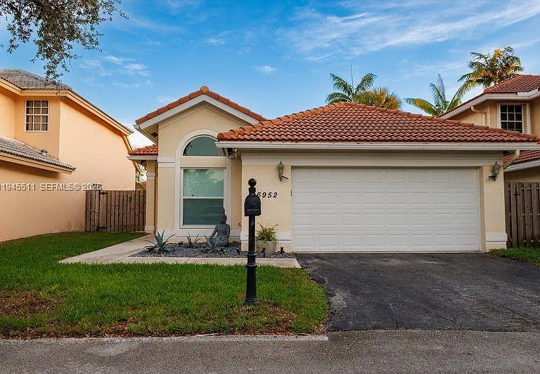 6952 NW 27th Ct — Photo 1