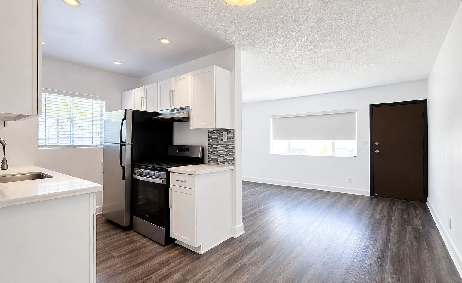 Renovated 2BR w/ Huge Private Patio | Gated, 2 Parking Spaces + In-Unit Laundry — Photo 2