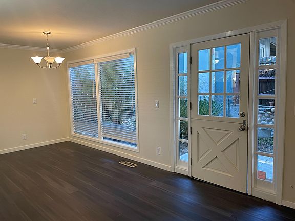 Side door to private patio/garden between living room and dining room