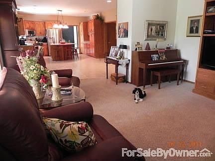 Family Room
						:
						Family room off kitchen with custom built-in entertainment center and fireplace.