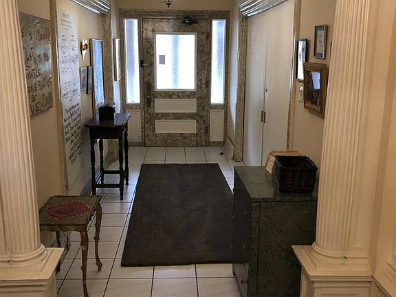 Mansion entrance door and hallway