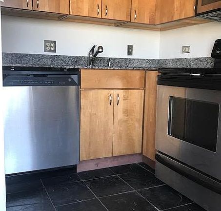 Light filled Kitchen - Stainless Steel Appliances, Dishwasher, Granite Counter top, Slate Flooring