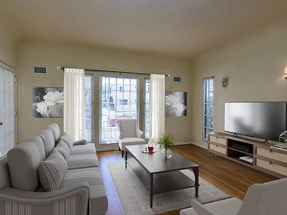 Spacious living room with huge windows with Huge Windows, or "combine" the living and dining rooms and use the hugs space as a Great Room