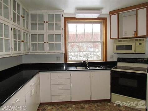 Lots of cabinets plus plenty of counter space. Granite counter top.