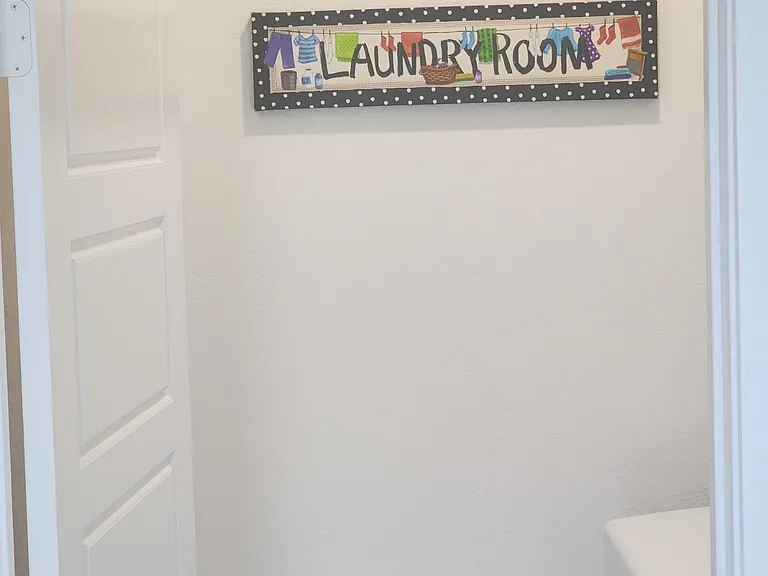 The utility room with washer and dryer is located on the main floor.