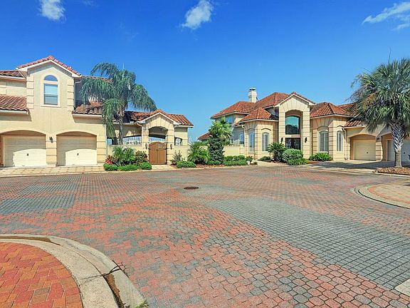 SPECTACULAR 1 OWNER MEDITERRANEAN COMPOUND SITUATED AT THE POINT PROVIDING UNPARALLELED WATER VIEWS ACROSS OVER 250' OF WATERFRONT. ENJOY WATERFRONT LIVING AT ITS' FINEST COURTESY OF THE OUTDOOR OASIS, WATERFRONT PATIOS AND BALCONIES AND DOCKING FOR 