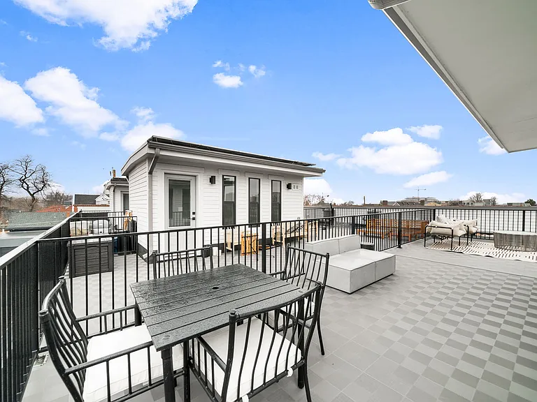 Rooftop deckRooftop deck with solar panels, gas connection, and electrical outlets
