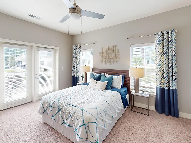 Union Chapel's second bedroom features a walk-in closet and door to the private patio or balcony. Union Chapel's second bedroom features a walk-in closet and door to the private patio or balcony.