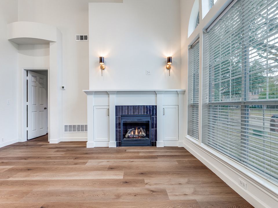 Another view of fireplace. New mantel with custom cabinets for storage. New lighting flanking fireplace wired for TV or art.