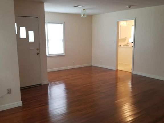 Living room. Looking from front bay window towards kitchen.