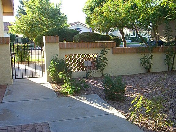 view from front walk looking out into front courtyard
