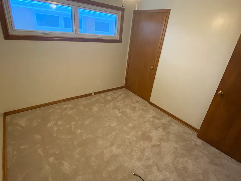1st Bedroom Interior - Closet door next to window
