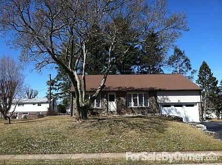 Front of house from street
						:
						Beautiful front yard on a quiet street across from a wooded cul-de-sac.
