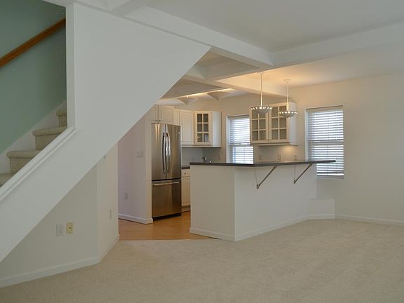 Living room with a view of the 4 place counter