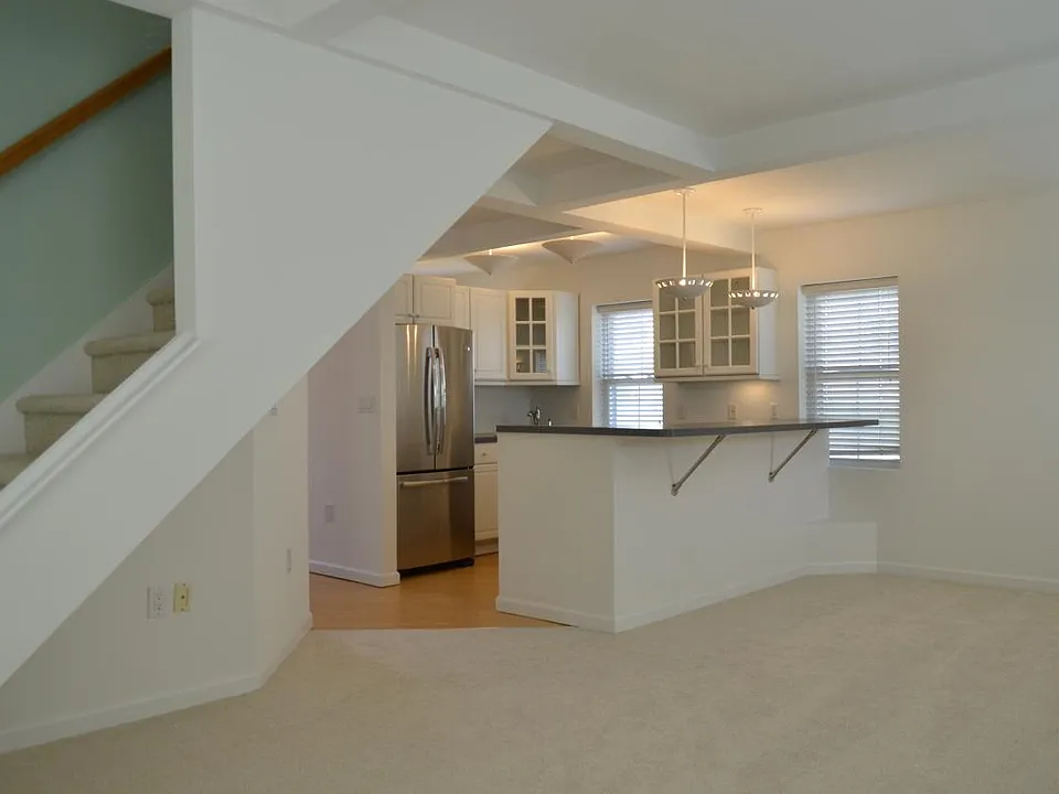 Living room with a view of the 4 place counter