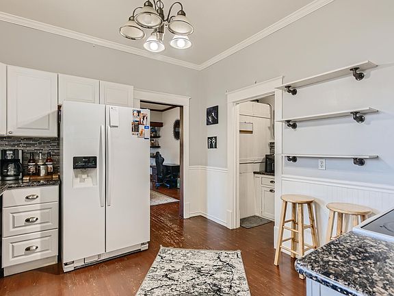 Kitchen looking to butler's pantry and dining.