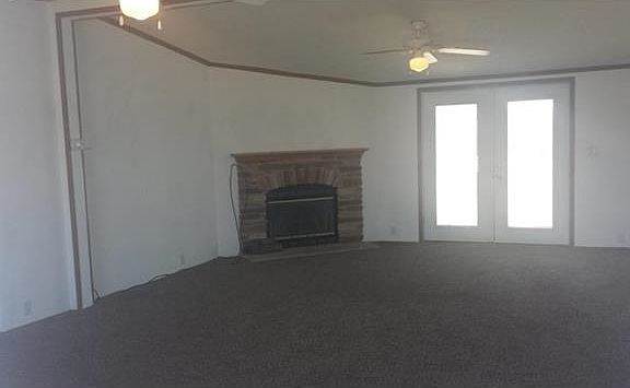 Large Living room with fire place.