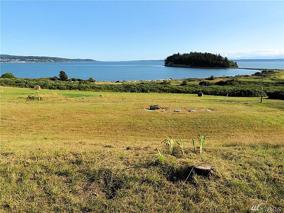 Unobstructed views looking South and Southwest to Polnell Point, Camano Island and the Olympic Mountain Range.  The septic system is installed and approved for a three bedroom home!