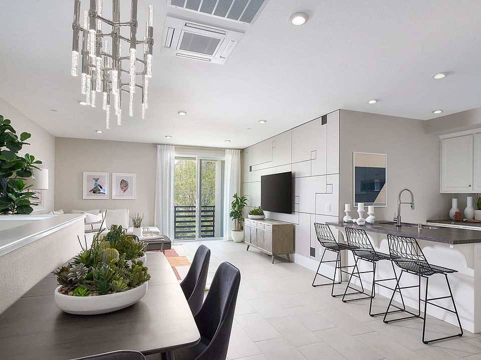 Dining room and kitchen in Residence Three at Broadway at Boulevard in Dublin, CA by Brookfield Resi