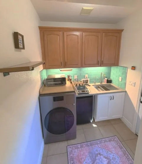 Kitchen includes a washer and dryer, mini fridge, induction burner, air fryer