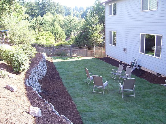 view from of the back yard from slate patio