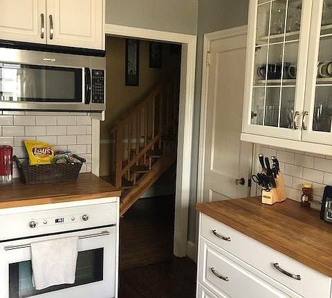 Kitchen with butcher block counters and pantyr
