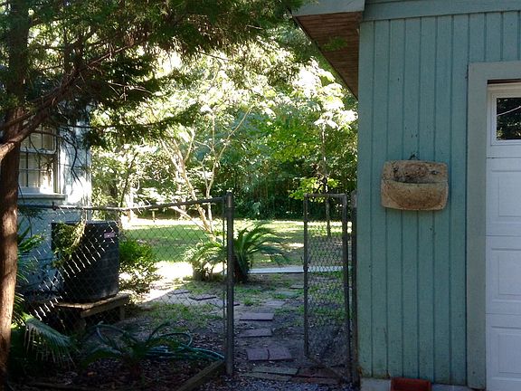 entrance to large fenced back yard