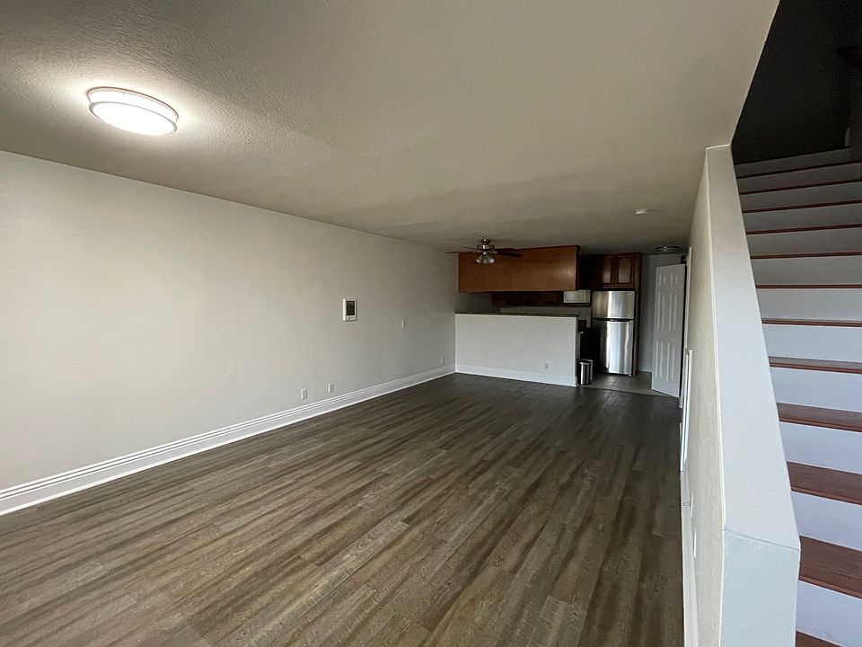 View from front entry - living area, kitchen, laundry area and downstairs bathroom.