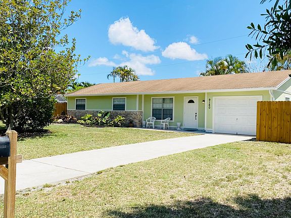 A large Magnolia tree and Golden Rain tree are located in the front yard. Their flowers are beautiful in bloom.