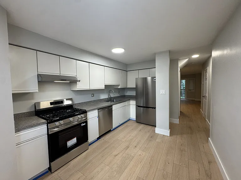 Beautifully renovated kitchen with brand new, stainless steel appliances.