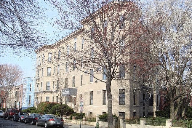Outside, #402 is the top floor unit on the closest end of the building