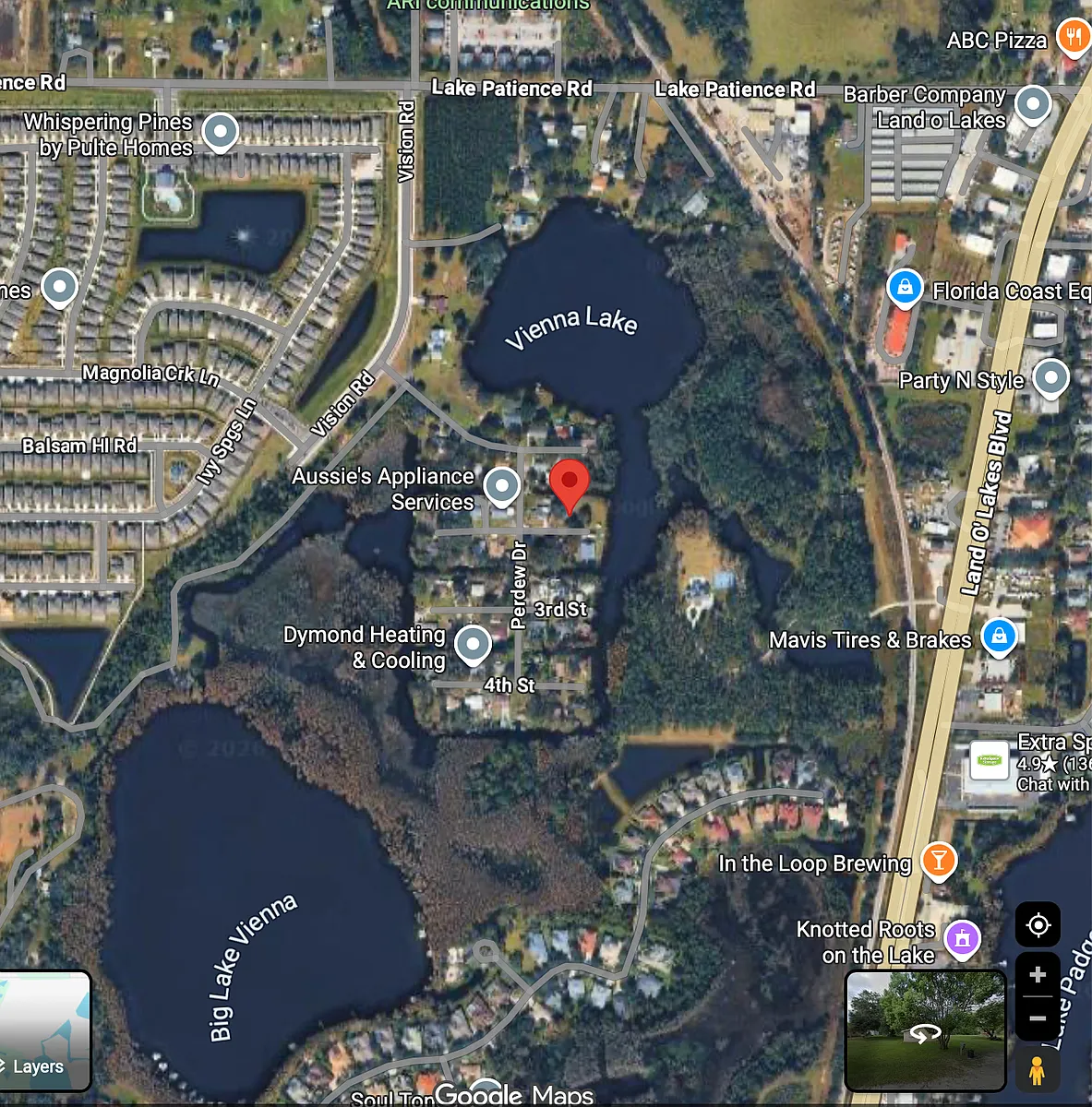 Satellite photo of PERDEW ISLAND showing location of property with red dot and access to both private lakes - 2nd St