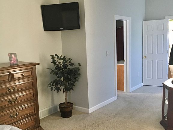 sitting area and entrance to bath off bedroom as well as hallway
