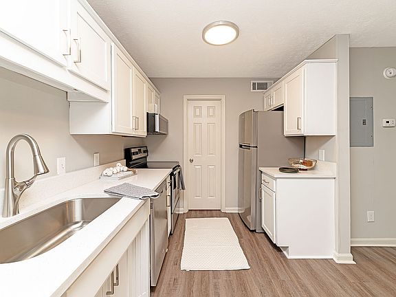 Kitchen with quartz counters, stainless appliances, and modern cabinetry