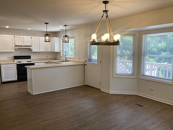 Open dining area with deck access