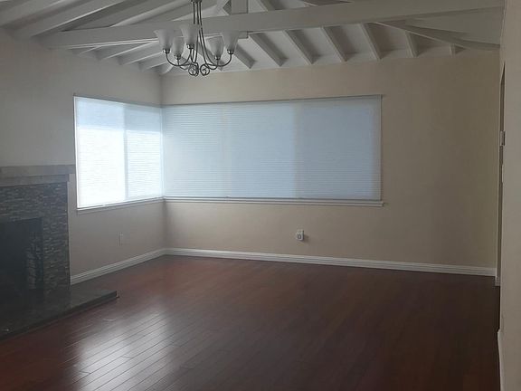 Bright XL Living Room w Beam Ceilings